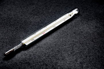 Old mercury thermometer to measure body temperature during illness