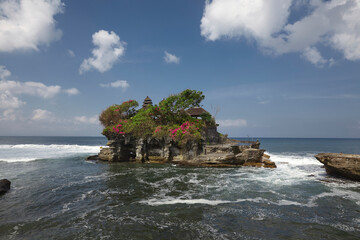 Tanah Lot water temple in Bali. Indonesia nature landscape. Tanah Lot temple in daylight, Bali island. Popular temple of Bali, Indonesia landmark