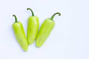 Geen hot peppers on a white background.