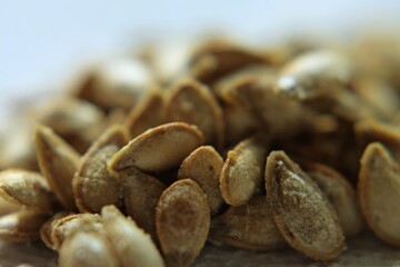 Macro of roasted and salted pumpkin seeds