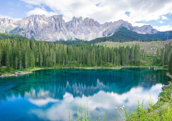 Amazing and turquoise Carezza lake, Dolomites Alps. South Tyrol. Italy