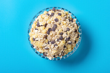 top view glass bowl of mixed oatmeal and maize and dark grains and red jujube and coix seed