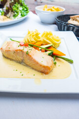 french cuisine dish with tomato and salmon