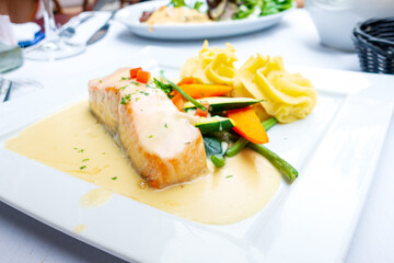 french cuisine dish with tomato and salmon