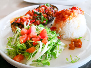 Delicious Eggplants with beef stewed, vegetables and rice.