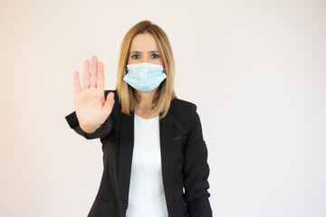 Young businesswoman making a rejection pose on a white background