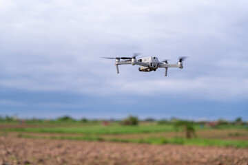 Fototapeta na wymiar agriculture drone flight farmland survey in field .