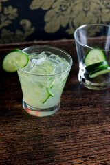 Cocktails. Traditional American drinks made by artisanal bartenders or mixologists in speakeasy & upscale bars or dives or taverns.Cocktails served in chilled cocktail glasses & garnished with fruit.