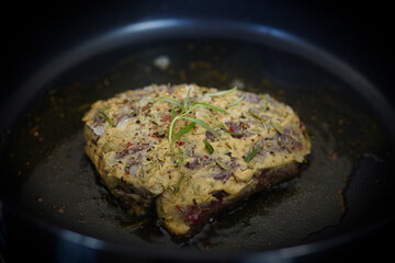 cooking at home - roasted game meat from the chamois buck with onions and rosemary