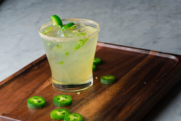 Cocktails. Traditional American drinks made by artisanal bartenders or mixologists in speakeasy & upscale bars or dives or taverns.Cocktails served in chilled cocktail glasses & garnished with fruit.