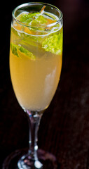 Cocktails. Traditional American drinks made by artisanal bartenders or mixologists in speakeasy & upscale bars or dives or taverns.Cocktails served in chilled cocktail glasses & garnished with fruit.