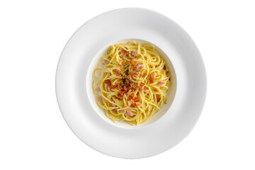 Top view of Spaghetti carbonara with bacon on white background.