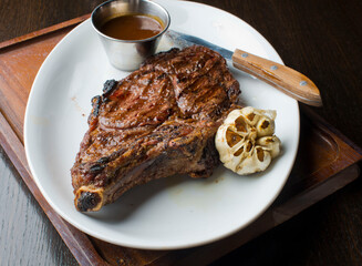 Steak. Grass-fed skirt steak, grilled to a medium rare and served with a garlic herb butter sauce and paired with roasted potatoes and Brussels sprouts. Classic American steakhouse favorite.