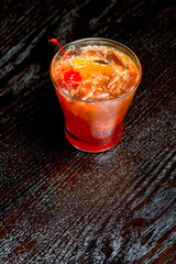 Cocktails. Traditional American drinks made by artisanal bartenders or mixologists in speakeasy & upscale bars or dives or taverns.Cocktails served in chilled cocktail glasses & garnished with fruit.