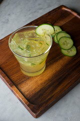 Margarita. Classic traditional Mexican cocktail. Made with Blanco tequila, fresh lime juice, agave syrup and orange juice. Served in salt rimmed tumbler over ice and garnished with a lime.