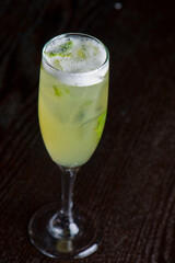 Margarita. Classic traditional Mexican cocktail. Made with Blanco tequila, fresh lime juice, agave syrup and orange juice. Served in salt rimmed tumbler over ice and garnished with a lime.