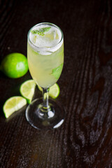 Margarita. Classic traditional Mexican cocktail. Made with Blanco tequila, fresh lime juice, agave syrup and orange juice. Served in salt rimmed tumbler over ice and garnished with a lime.
