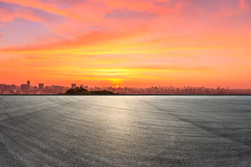 Fototapeta premium Race track road and city skyline with buildings in Hangzhou at sunrise.