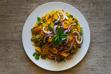 Delicious the chicken biryani with raita sauce
