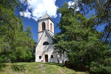 Fototapeta na wymiar Mountain landscape with church on it