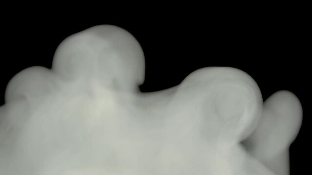 White Smoke Or Fog On A Black Background.Boiling Is The Bubbling Of A Gaseous Cloud Of Steam Or Chemical.Glossy Rolling Toxic Gas Cloud Of Reagent In Chemistry.Toxins And Toxic Substances In Motion