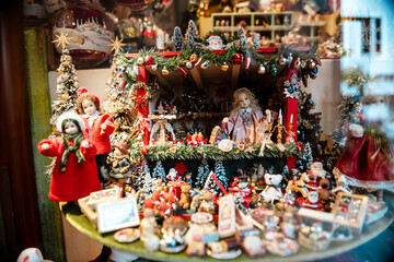 Elements of Christmas New Year decoration on Christmas Market in Europe with Christmas tree, toys and souvenirs.