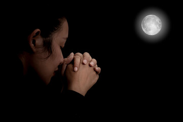 Woman's hand praying and worship to GOD Using hands to pray in religious beliefs and worship...