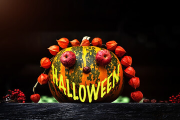 Halloween - text on a decorated pumpkin as a smile. The concept of autumn, harvest harvest,...
