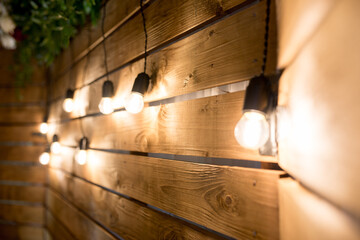 decorative lamps on the background of a wooden wall