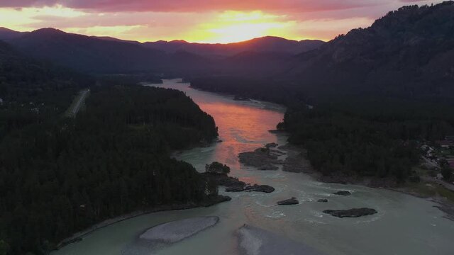 The mountain river view from high. Mountain landscapes. Pink sunset