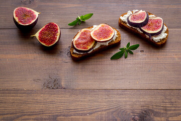 Canape or sandwich with figs and cheese, overhead view
