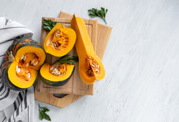 Autumn Thanksgiving background. Pumpkins on white table.  Concept of Thanksgiving day or Halloween.