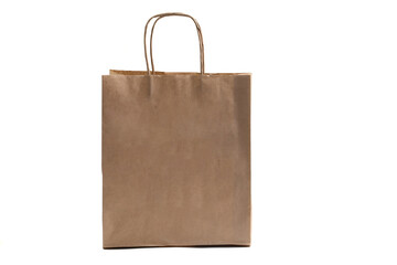 Layout of a shopping bag made of Kraft paper with handles on an isolated white background.