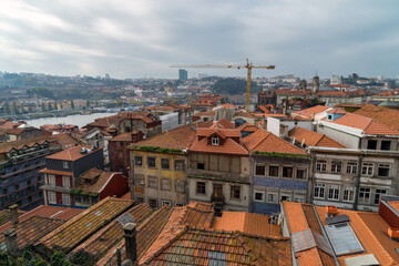Fototapeta na wymiar City of Porto, Portugal. Old city tiled roofs and urban sprawl.