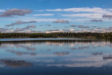 Mirror surface of forest lake in autumn, gold autumn, serenity of nature