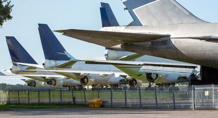 Obraz na płótnie Canvas UK 2020. Passenger jets on an airfield waiting to be totally scrapped.