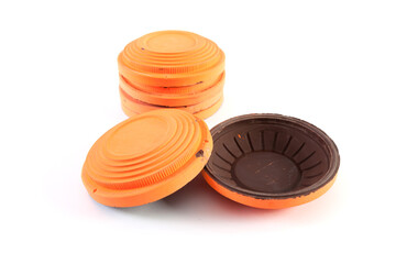 Orange cymbals for trap shooting on white background