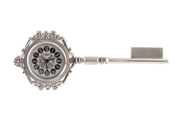 Souvenir clock in shape of  key on white background