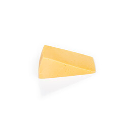 Shooting in the studio. A piece of yellow cheese, cut from the head. Close-up. On white background.