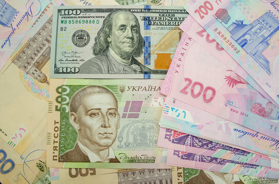 Currency ratio concept. 100 dollar bill and 500 hryvnia banknote. Close-up. Ukrainian money and dollars.