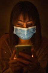 Woman Wearing Face Masks Using Mobile Phone