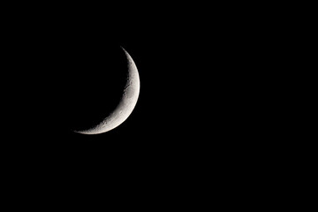 Fototapeta na wymiar Crescent moon shining in the night sky