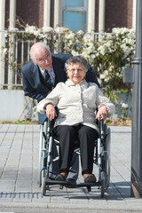 Fototapeta na wymiar a senior couple in wheelchair
