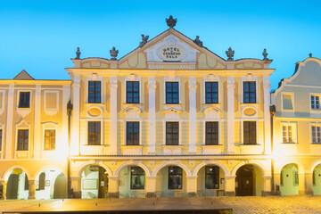 Traditional houses on the main square of Telc, South Moravia, Czech Republic. UNESCO heritage site. Town square in Telc with renaissance and baroque colorful houses. Early evening or night scene.