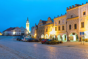 Fototapeta na wymiar Traditional houses on the main square of Telc, South Moravia, Czech Republic. UNESCO heritage site. Town square in Telc with renaissance and baroque colorful houses. Early evening or night scene.