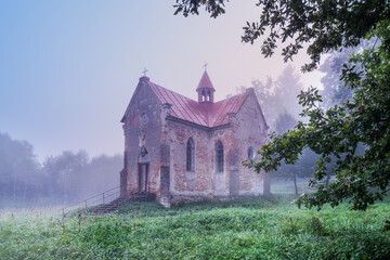 Misty dawn at a deserted church in one of the Polish villages.