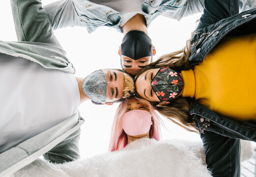 Multiracial Milenial Friends Taking Selfie With Closed Face Masks - New Normal Lifestyle Concept With Young People Having Fun Together