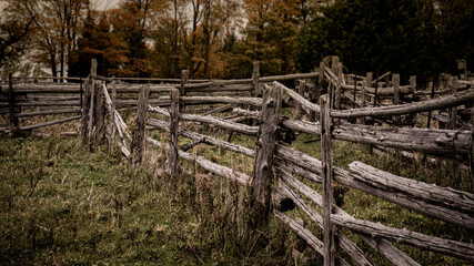 Weathered old wooden fence on abandoned farm