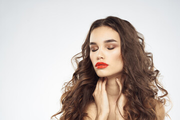 Fototapeta premium Elegant woman with bare shoulders red lips glamor attractive look cropped look