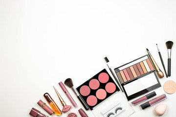 Collection of various make-up accessories. Feminine beauty kit on white. Cosmetic products in...